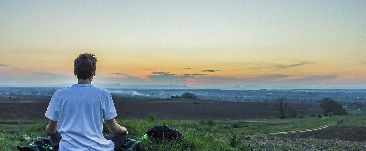 Man relaxing in the countryside after taking the adaptogen ashwagandha root